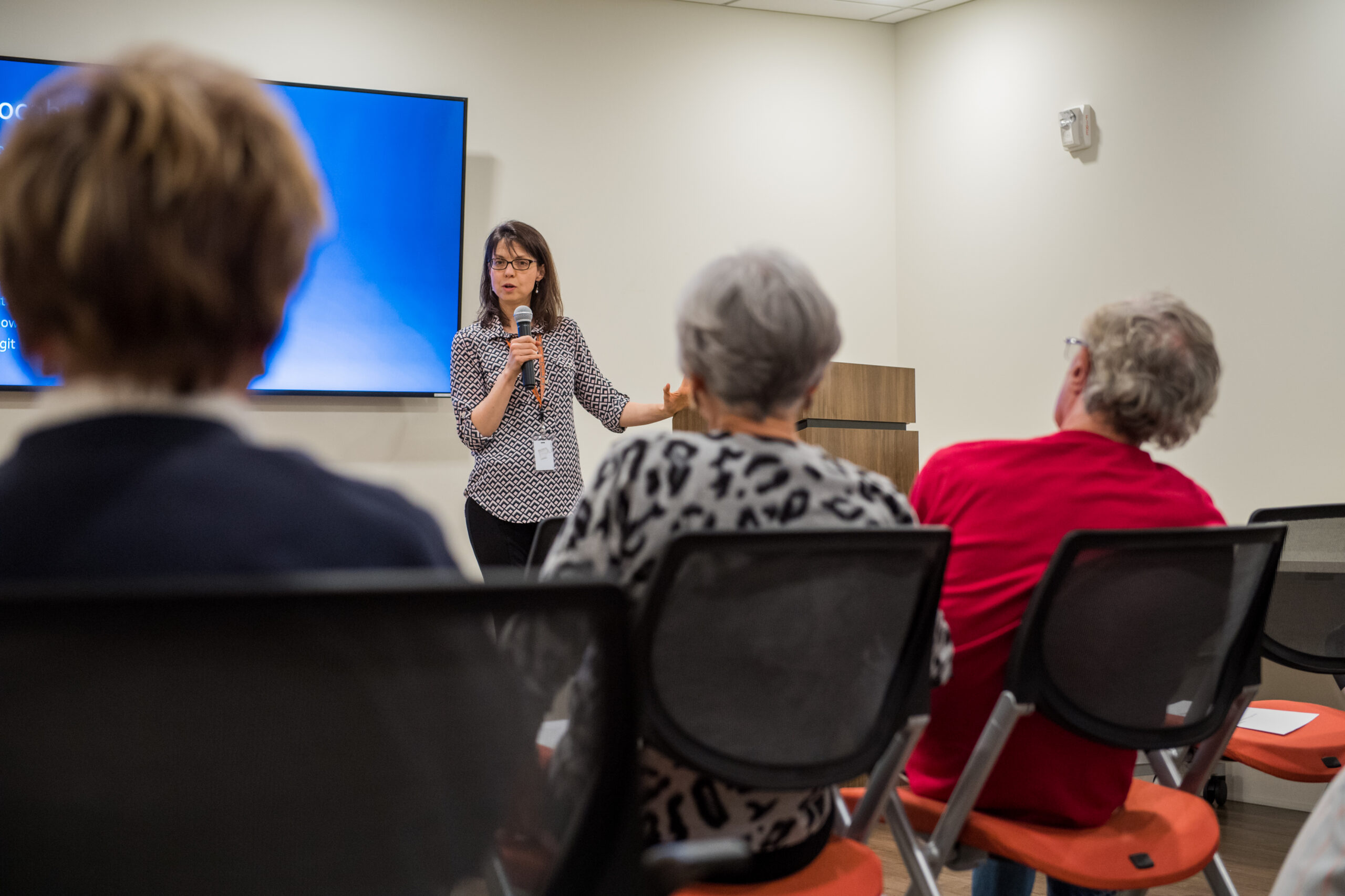 speaker presenting to a room of seniors